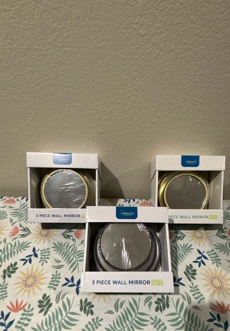 Interiors by Design 3-Piece Round Wall Mirror Set (5, 6, and 7-inch diameters).